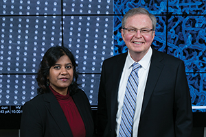 Manashi Nath (left) and Jay A. Switzer stand in front of their respective nanowire creations.