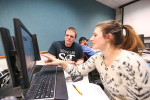 Avery Welker helping students